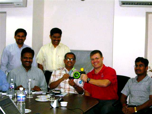 Ravi Thota and colleagues in a meeting room